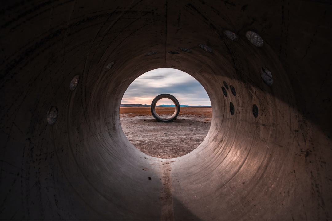 Two concrete tubes in an open land